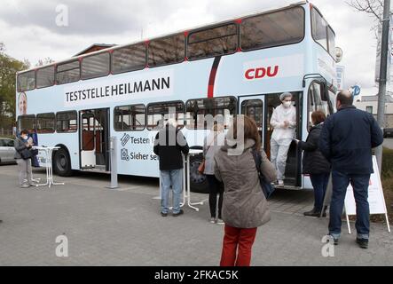 Berlin, Germany. 26th Apr, 2021. In cooperation with a pharmacy, the member of the Bundestag Heilmann (CDU) has set up a bus as a testing station in the district of Steglitz-Zehlendorf. (to dpa 'Election campaign in Corona times - MP opens Corona test station') Credit: Wolfgang Kumm/dpa/Alamy Live News Stock Photo