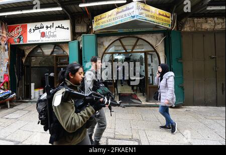Israeli border police soldiers patrolling the Muslim quarter in the old city of Jerusalem. Stock Photo