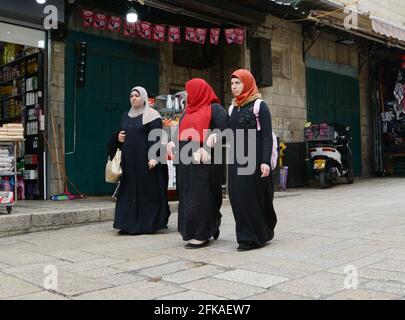 Palestinian women at Al-Wad street in the Muslim quarter in the old city of Jerusalem. Stock Photo