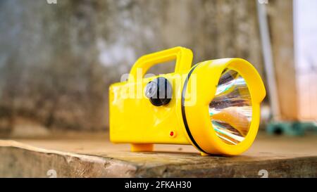 Electronic Super Bright LED Flashlight with yellow color for Emergency Traffic or Parking Arrangement Tools. Stock Photo