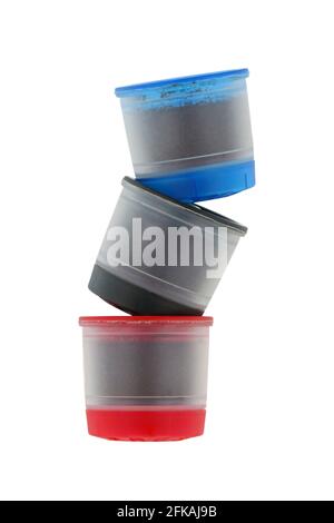 Different types of single serve Coffee capsules in blue, black and red isolated on white background Stock Photo