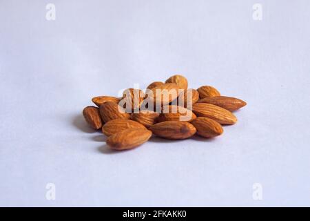 Group of almonds seeds nut on white background. Stock Photo