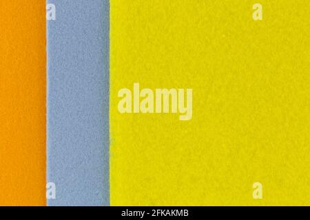 Closeup texture photo of super Absorbent fabrics in orange blue yellow color. Abstract background of absorbing cloth Stock Photo