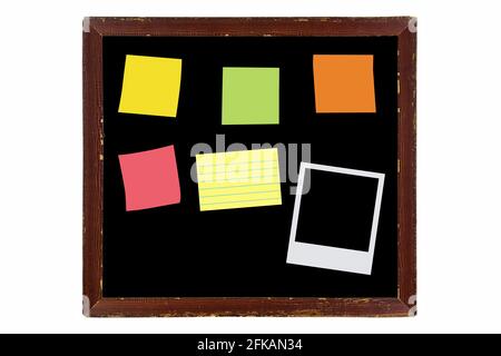 Blank vintage wooden picture frame made of wood in brown with sticky notes, instant film, isolated on white background Stock Photo