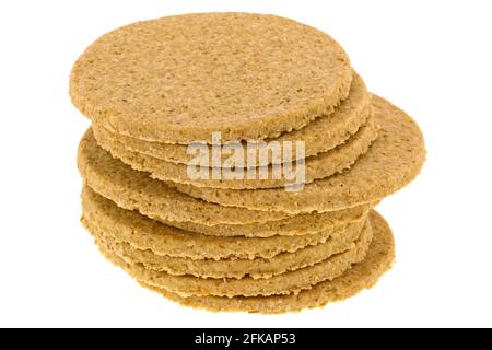 A stack of gluten free crumbly rough Oatcakes, isolated on white background Stock Photo