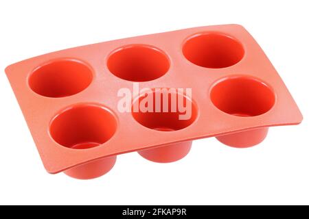 Red silicone mold to make muffin and cupcake, isolated on white Stock Photo