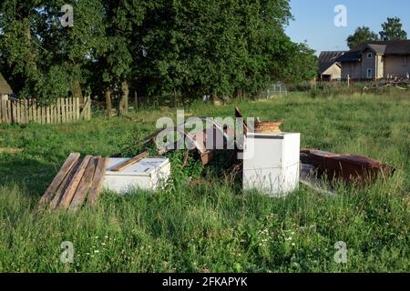 Dump of old technology in nature. Scrap metal. Stock Photo