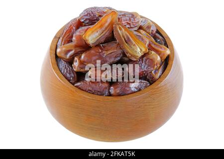 A wooden bowl full of natural dried Deglet Nour dates from Israel Stock Photo