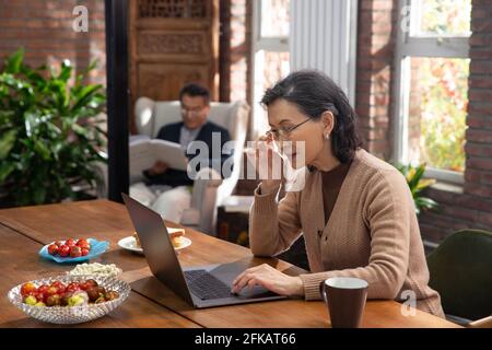 Elderly couple enjoy leisure time at home Stock Photo