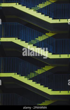 Yellow stairs, fire escape ladders, mall parking stairs Stock Photo