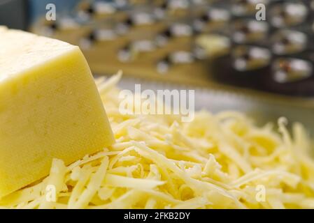 Cheese and Grated cheese, close-up. blurred background Stock Photo