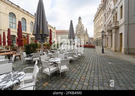 30 April 2021, Saxony, Dresden: Outdoor seats of restaurants are set up on the Neumarkt in front of the Frauenkirche. Photo: Robert Michael/dpa-Zentralbild/dpa Stock Photo