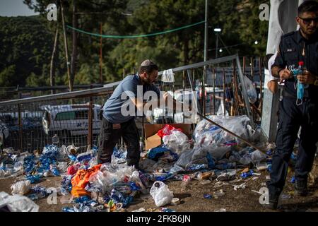 Mount Meron, Israel. 30th Apr, 2021. A worker clears the Jewish Orthodox pilgrimage site of Mount Meron, where dozens of worshippers were killed in a stampede during the Jewish religious festival of Lag Ba'Omer in northern Israel early on Friday. Credit: Ilia Yefimovich/dpa/Alamy Live News Stock Photo