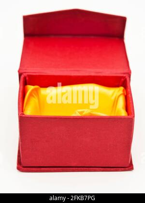 Red Inner Box open red box satin lined yellow inside Stock Photo - Alamy
