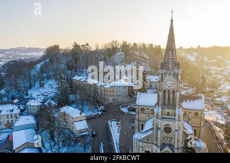 Aerial shot of church in a small town of France Stock Photo