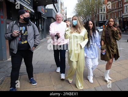 London, UK. 30th April 2021. Little Mix, Perrie Edwards, Jade Thirlwall and Leigh-Anne Pinnock, leave the studios of Global Radio in Leicester Square. Credit: Tommy London/Alamy Live News Stock Photo