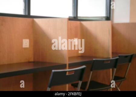 Library cubicles with power outlet. Defocused, blurred effect for background concept. Stock Photo
