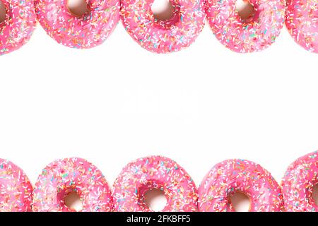 Top and bottom donuts border. Top view of yummy fresh homemade doughnuts.  Stock Photo