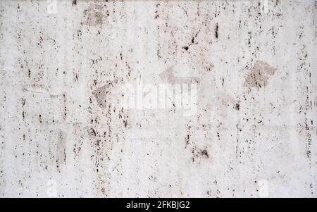 old concrete background wall damaged with holes and stains Stock Photo