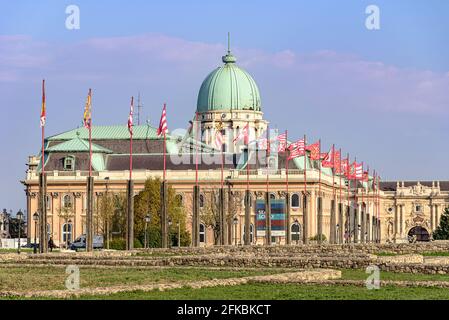 The Royal Palace in the Buda Castle District with historical flags Stock Photo