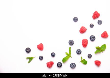 Bunch of fresh organic mixed berries, blueberry, raspberry & mint in seamless pattern, white background. Clean eating concept. Healthy vegan snack, ra Stock Photo
