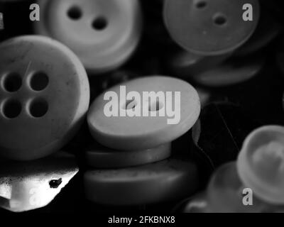 Collection of assorted spare clothes buttons. Macro. DOF Stock Photo