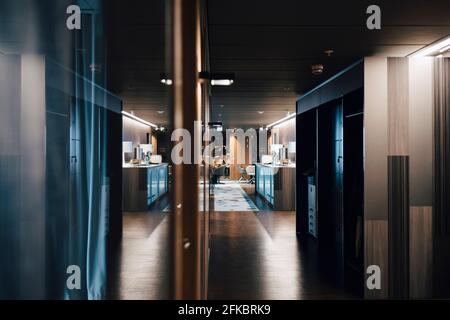 Illuminated corridor in corporate office Stock Photo
