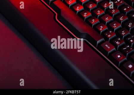 Gaming computer keyboard on a dark background. Stock Photo