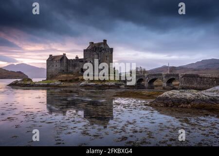 Sunset behind Eilean Donan Castle on Loch Duich in the Scottish Highlands, Scotland, United Kingdom, Europe Stock Photo