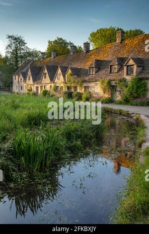 Early Spring morning view of the beautiful Cotswolds cottages at Arlington Row in Bibury, Gloucestershire, England, United Kingdom, Europe Stock Photo