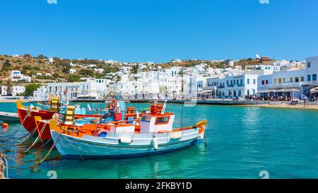 Mykonos Island, Greece - April 22, 2018:  Waterfront and fishing boats in the Old Port of Mykonos. Panoramic view Stock Photo