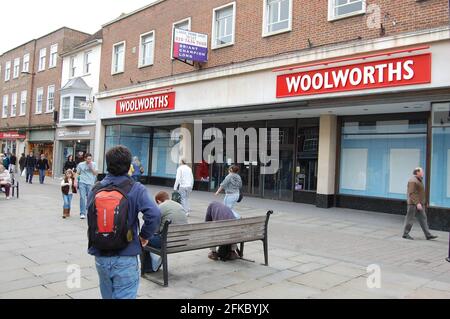 Woolworths Salisbury famous sold business  outside backpack seat entrance door doors paved area swing doors people outside sign for sale Stock Photo