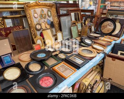 Market stall selling second hand picture frames in Portobello Market, Notting Hill, London, UK Stock Photo