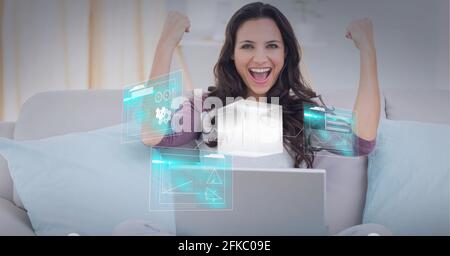 Composition of screens with data processing over businesswoman using laptop Stock Photo