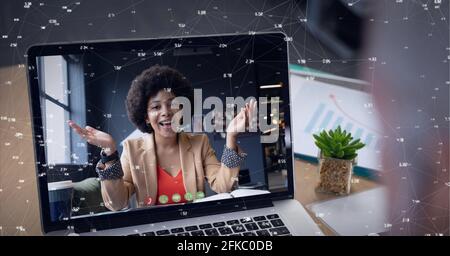 Composition of network of connections with numbers over businesswoman on laptop video call screen Stock Photo