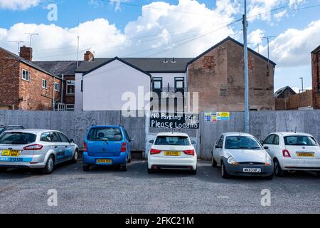 Ignored' No Parking here please 24/7 loading' request on entrance to building site in Crewe Cheshire UK Stock Photo