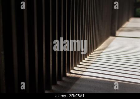 The morning sunlight shining through the rectangular pillars. parallel lines of light Stock Photo