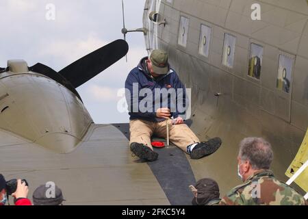 Dipping the tank. Dipstick checking of fuel levels in the fuel tank. World War 2 C-47 airplane named That's All, Brother. This restored historic aircr Stock Photo