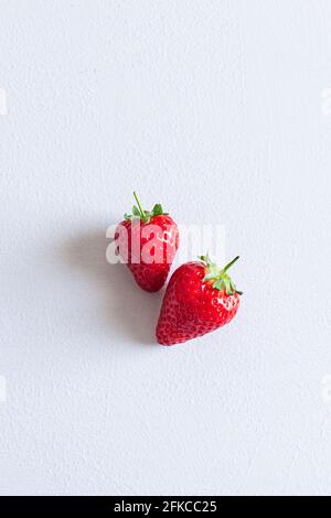 Two strawberries isolated on a white background. Stock Photo