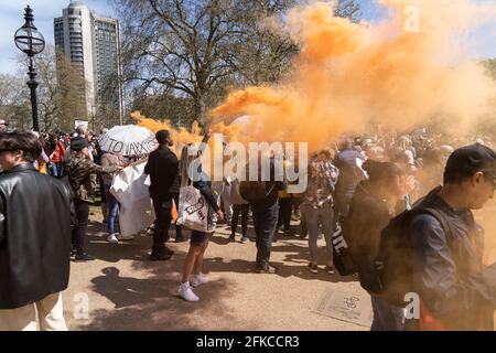 Smoke bombs are let off as protesters gather in Hyde Park, London, UK. 24.01.21
