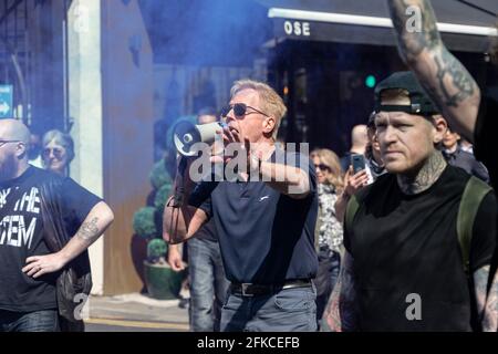 Man shouting through a megaphone to protest vaccine passports. London, England, UK. 24.01.21 Stock Photo