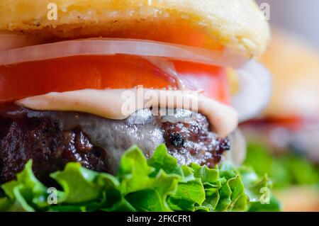 Home made barbecue cheese burgers in brioche bread buns Stock Photo