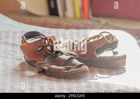 Real light brown old women's sandals like symbol of history Stock Photo