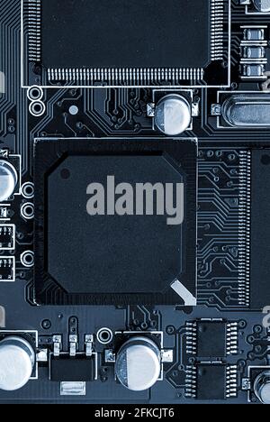 Electronic circuit board close up. toned. Vertical image Stock Photo