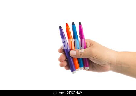 female hand holding various colored markers, isolated on white, space for text Stock Photo