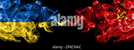 Ukraine, Ukrainian vs USSR, Soviet, Russia, Russian, Communism smoky mystic flags placed side by side. Thick colored silky abstract smokes flags. Stock Photo