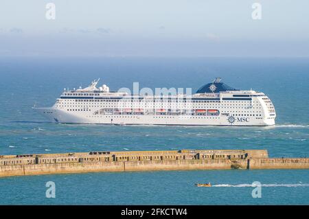 MSC Lirica, cruise ship, luxury liner leaving the Port of Dover, the cross-channel port situated in Dover, Kent, SE England. Cruise liner departing Stock Photo