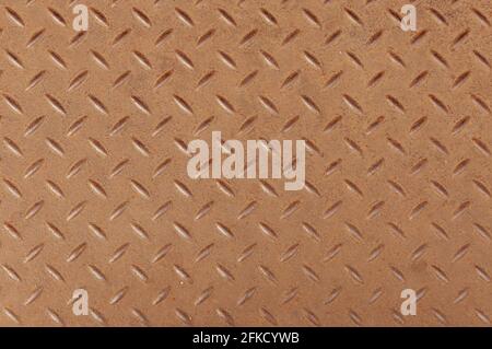 Top view of Slightly rusted steel diamond pattern sheet as background. Stock Photo