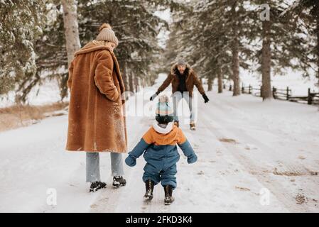 Canada, Ontario, Parents with baby boy going on winter walk
