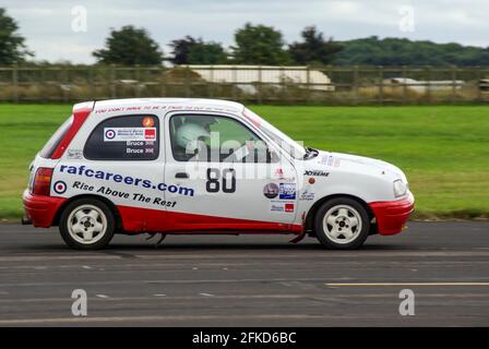 Richard Burns Memorial Rally 2009 at RAF Marham, Norfolk, UK, with Phil Bruce racing a Nissan Micra rally car with RAF careers advertising Stock Photo